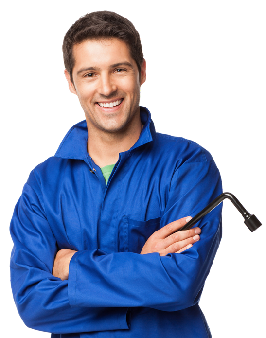 Mechanic in blue jumpsuit with arms crossed, holding a wrench, smiling.