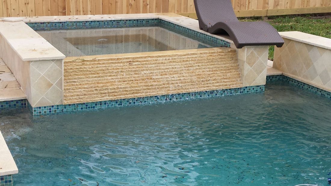 There is a chair in the middle of the pool.