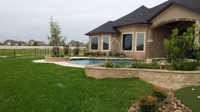 A large house with a pool in the backyard.