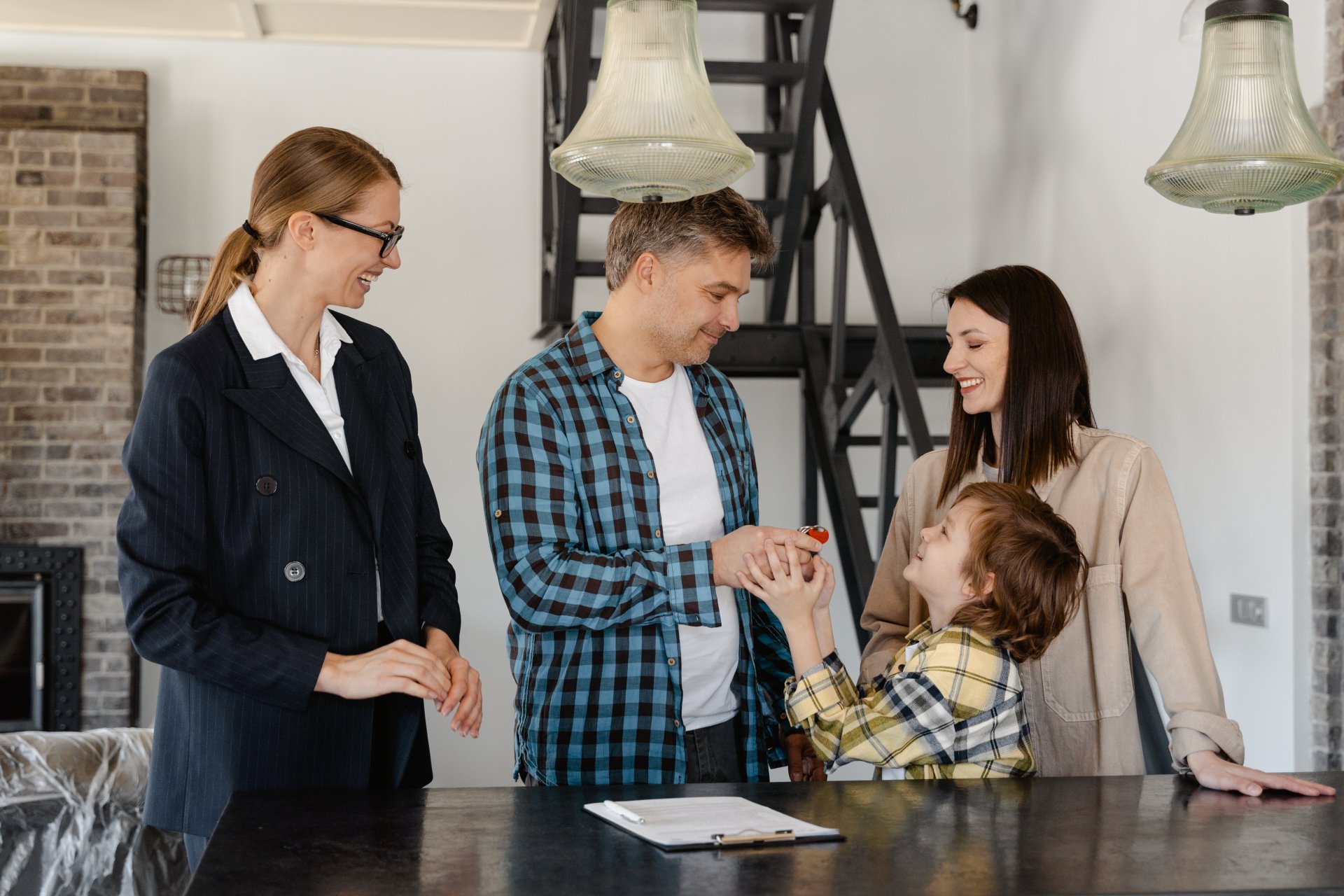 A family is buying a house with a real estate agent.